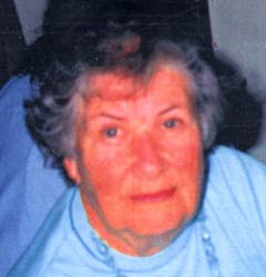 Color photograph of older Jill in light blue.