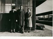 John, Kiersten and other gentleman standing at train station.