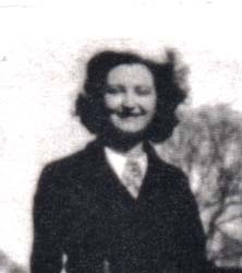 Archival image of a young lady wearing a black coat.