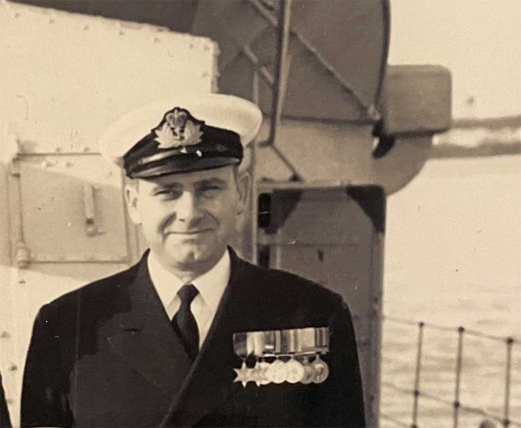 An archival image of a young man in naval uniform.