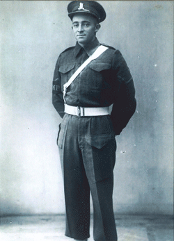 Full length portrait of young Cecil in uniform.