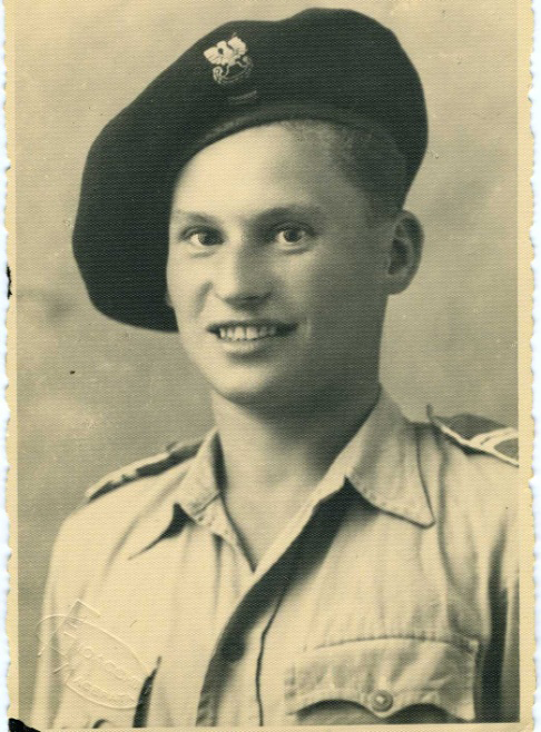 Old photo of young man in military uniform.