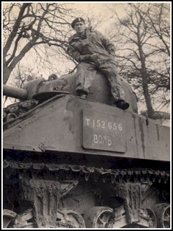 Young Walter in army gear, sitting on his tank, Bomb.