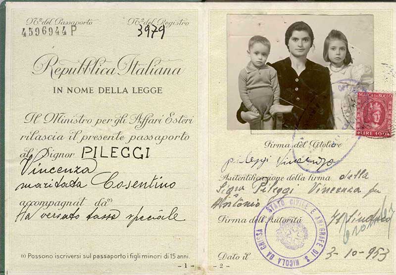 Old passport showing woman and two small children and Italian writing.