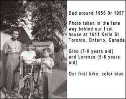 Outdoor photograph of a man, two children and a bike.