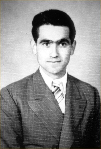 Portrait of Antonio in a suit and tie.