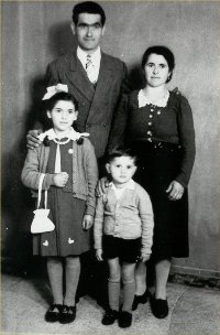 Portrait of father, mother and young daughter and son.