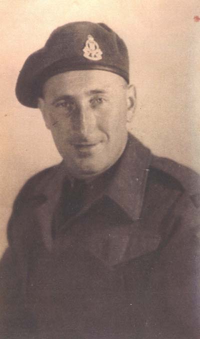 Photograph of George in military uniform and beret.