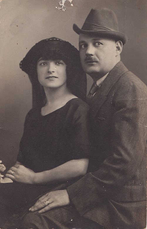 Black and white portrait of a man and woman seated next to each other.