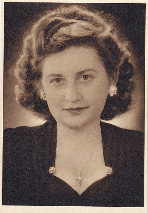 Young woman looks directly into the camera as she poses.