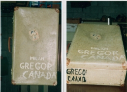 Old beige suitcase, with a mention of Milan Gregor, Canada written on it. 