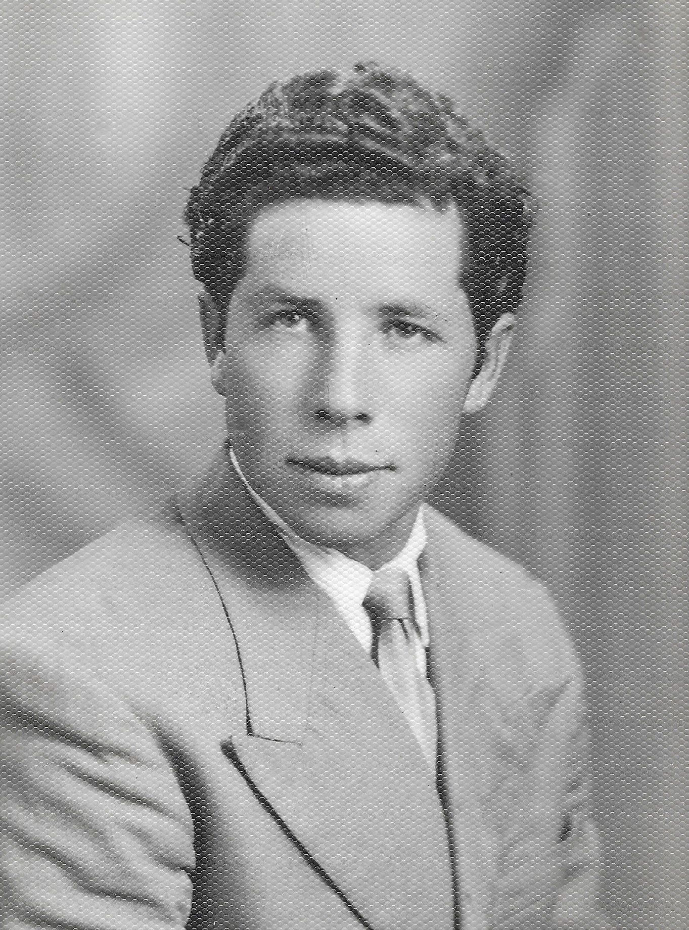 A black and white portrait of an Italian man.