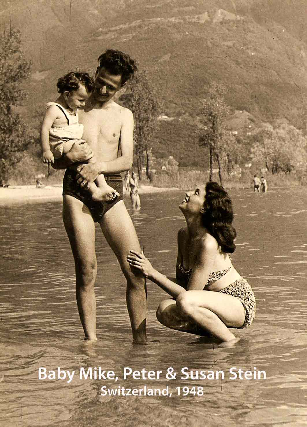 A sepia toned photo of a Slovakian family in a lake, the father holding a baby and the mother crouching in the water.