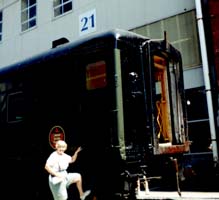 Ilse standing outside the display train car in front of Pier 21 Museum.