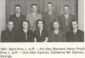 Family photo with two women, three men seated and four men standing behind.