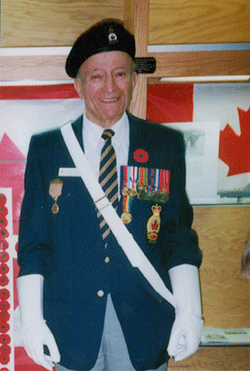 Middle-aged Ernest wearing military uniform with medals, beret and white gloves.