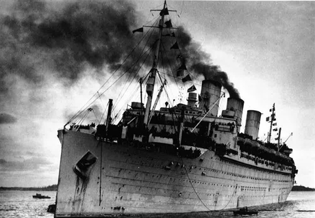 The ship, Ile de France, with smoke billowing from funnel.