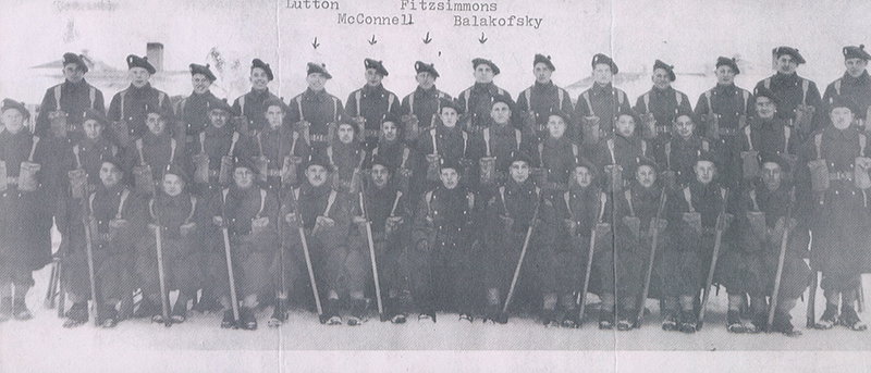 Very large group of men in military uniform, four names have been added for identification.