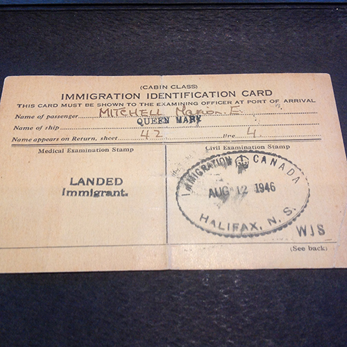 Immigration identification card port of arrival with landing stamp and passenger details.