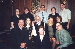 Older Robert, sitting among his eleven grandchildren.