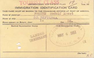 Old yellow document reading Immigration Identification Card.