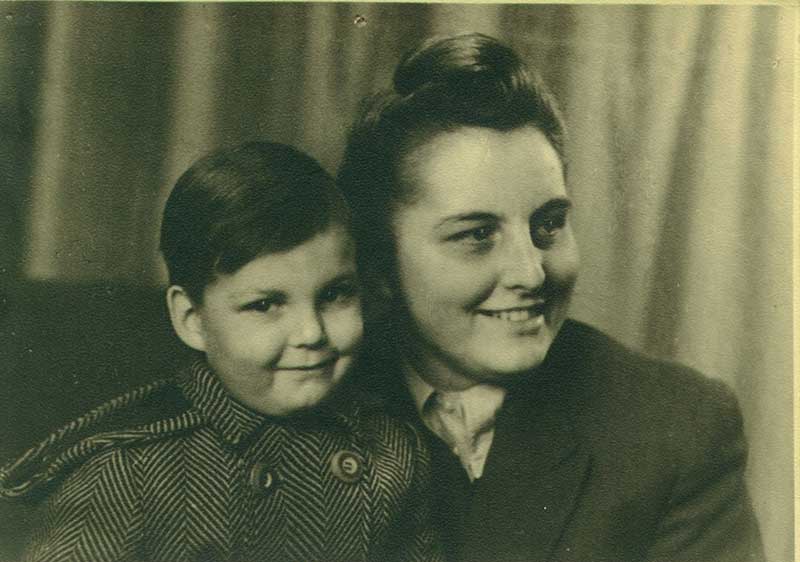 Black and white photo of little boy and woman.
