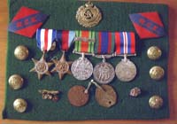 Assortment of medals, pins, badges and shoulder badges belonging to Clarence.