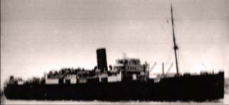 Old, darkened photo of ship HMS Chitral.