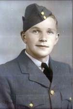Portrait of young Elmo wearing military attire and cap.