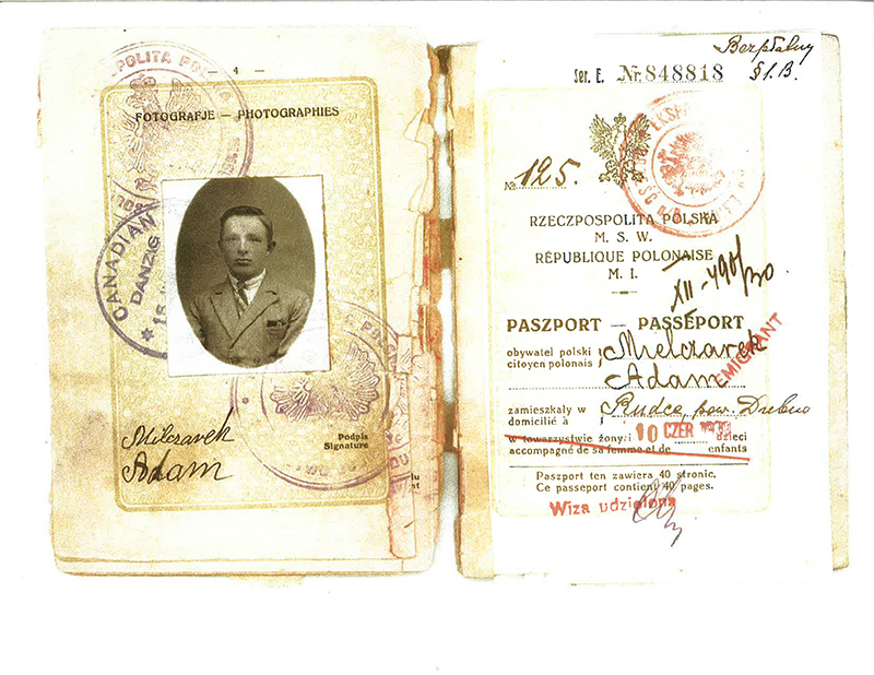 Old passport with head shot of young man.