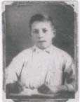 Portrait of Steven as a child, in white shirt.