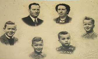Photos of family members taped to a piece of paper.
