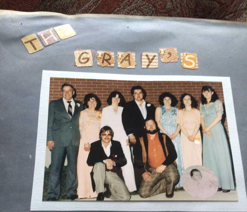 Family group photo pasted on paper with the name The Gray's.