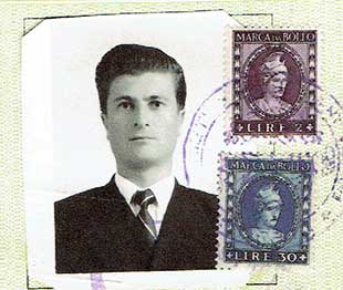 Headshot photo of well-dressed handsome man with two postal stamps and one blue stamp.