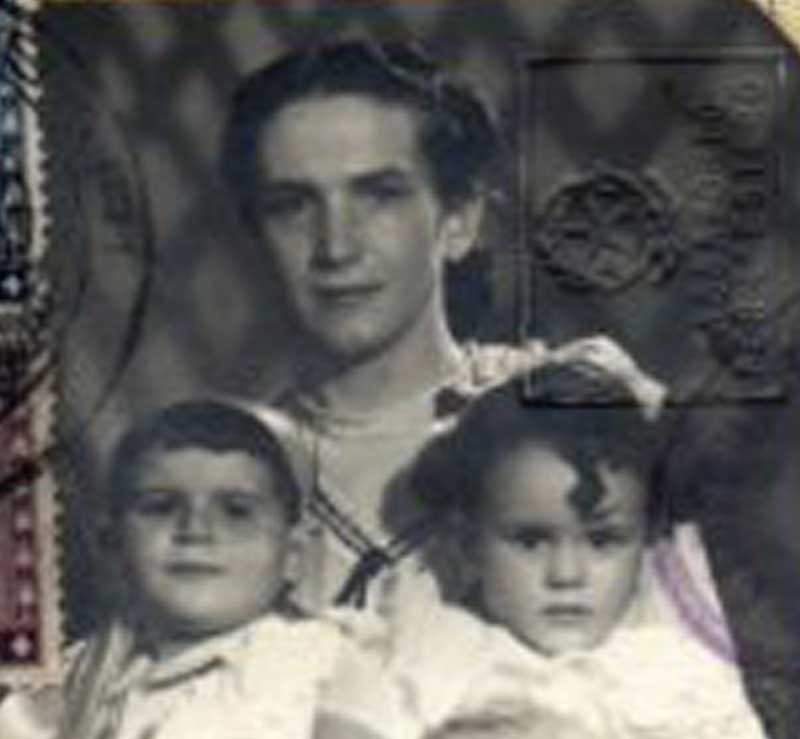 A woman with two children in a passport photo.