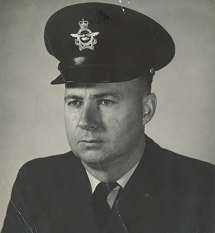 A man in uniform poses for a portrait.