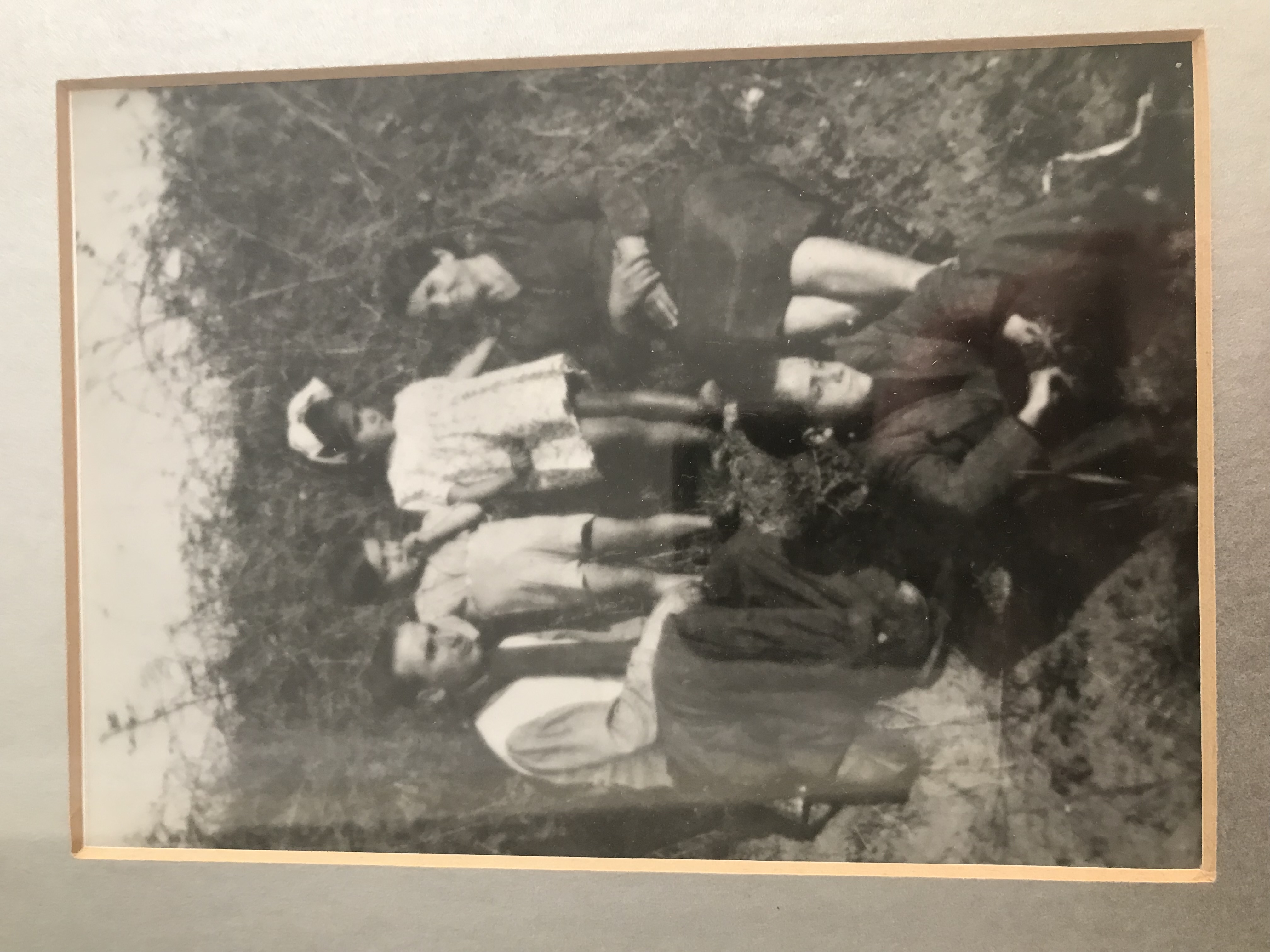 A black and white photo of an Italian mother, father, and three children outside.