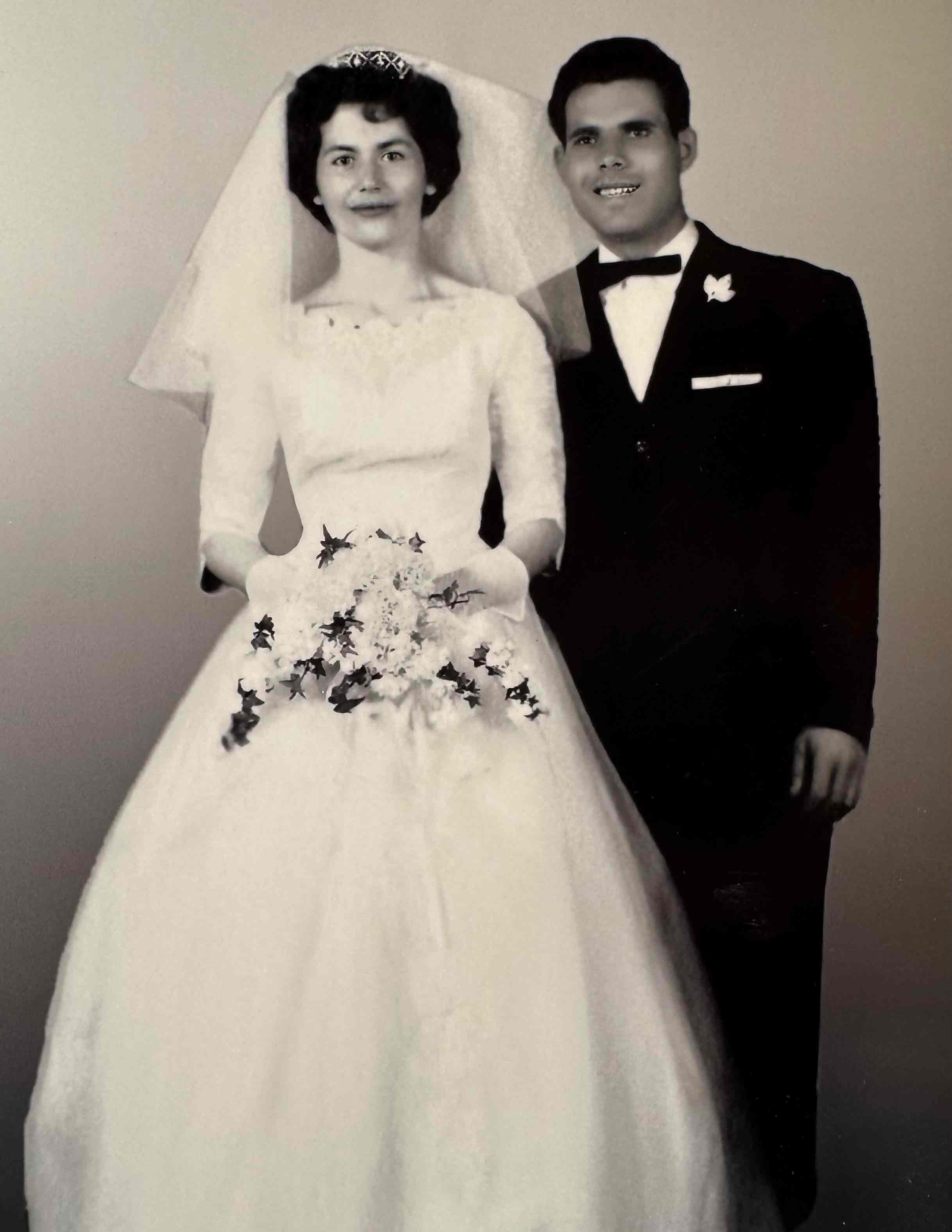 A black and white photo of a Greek couple on their wedding day.